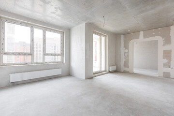 interior of the apartment without decoration in gray colors. rough finish