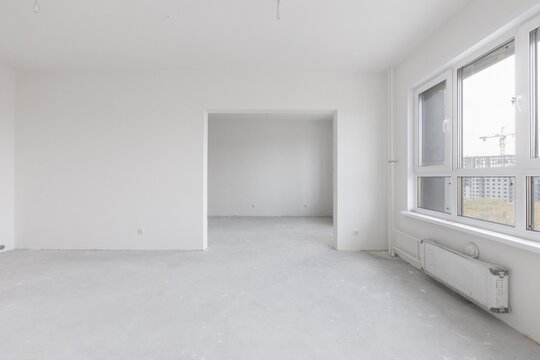 interior of the apartment without decoration in gray colors. rough finish