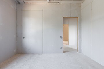 interior of the apartment without decoration in gray colors. rough finish