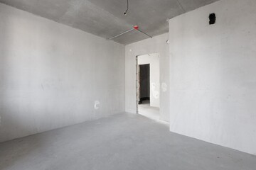 interior of the apartment without decoration in gray colors. rough finish
