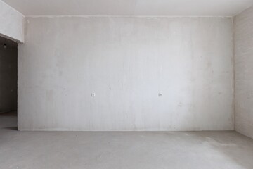 interior of the apartment without decoration in gray colors. rough finish