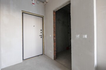 interior of the apartment without decoration in gray colors. rough finish