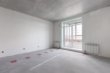 interior of the apartment without decoration in gray colors. rough finish