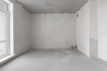 interior of the apartment without decoration in gray colors. rough finish