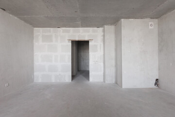 interior of the apartment without decoration in gray colors. rough finish