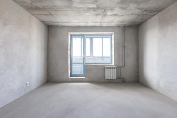 interior of the apartment without decoration in gray colors. rough finish