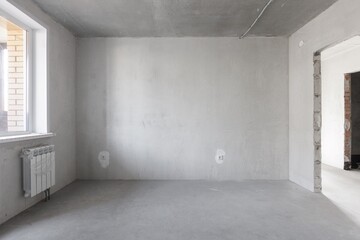 interior of the apartment without decoration in gray colors. rough finish