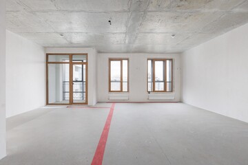 interior of the apartment without decoration in gray colors. rough finish