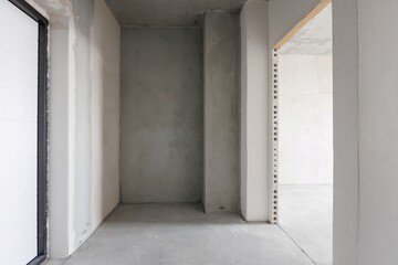 interior of the apartment without decoration in gray colors. rough finish