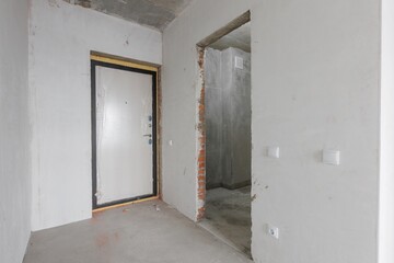 interior of the apartment without decoration in gray colors. rough finish