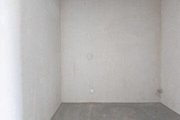 interior of the apartment without decoration in gray colors. rough finish