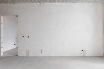 interior of the apartment without decoration in gray colors. rough finish