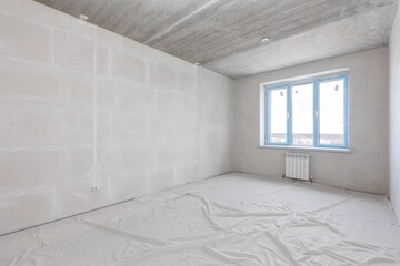 interior of the apartment without decoration in gray colors. rough finish