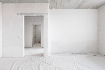 interior of the apartment without decoration in gray colors. rough finish