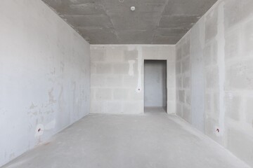 interior of the apartment without decoration in gray colors. rough finish