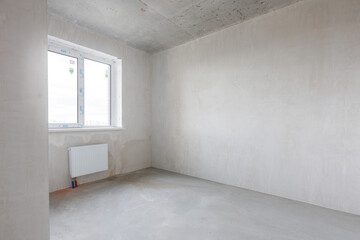 interior of the apartment without decoration in gray colors. rough finish