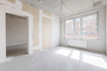 interior of the apartment without decoration in gray colors. rough finish