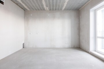 interior of the apartment without decoration in gray colors. rough finish