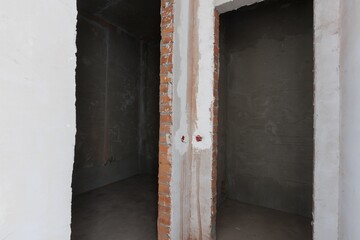 interior of the apartment without decoration in gray colors. rough finish