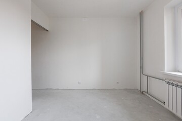 interior of the apartment without decoration in gray colors. rough finish