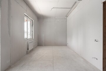 interior of the apartment without decoration in gray colors. rough finish