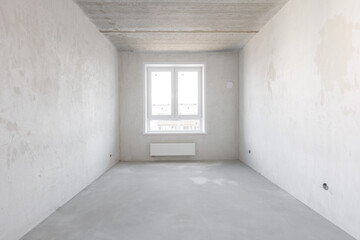 interior of the apartment without decoration in gray colors. rough finish
