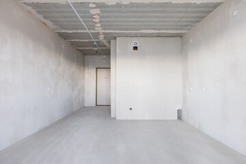interior of the apartment without decoration in gray colors. rough finish