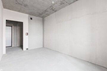 interior of the apartment without decoration in gray colors. rough finish