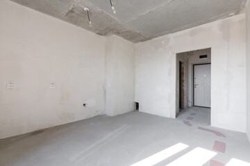 interior of the apartment without decoration in gray colors. rough finish