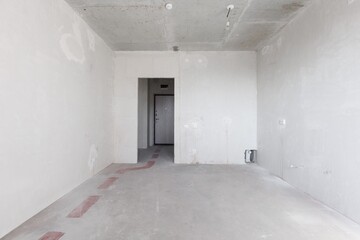 interior of the apartment without decoration in gray colors. rough finish