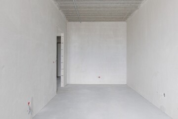 interior of the apartment without decoration in gray colors. rough finish