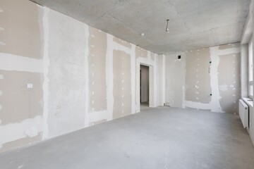 interior of the apartment without decoration in gray colors. rough finish