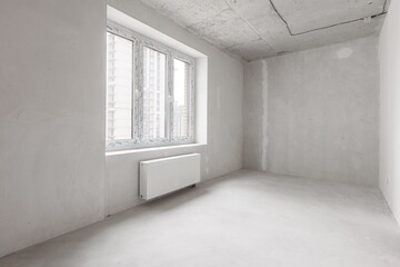 interior of the apartment without decoration in gray colors. rough finish