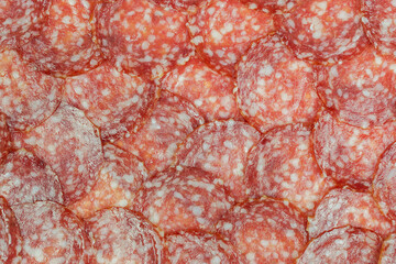 Sausage background (texture, pattern) from sausage slices - 705176165