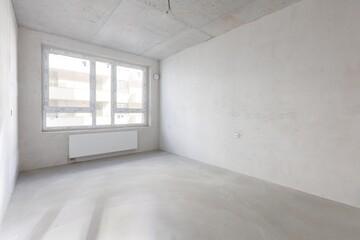 interior of the apartment without decoration in gray colors. rough finish