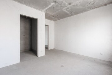 interior of the apartment without decoration in gray colors. rough finish