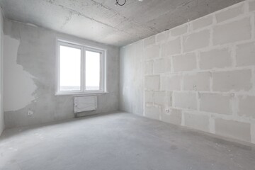 interior of the apartment without decoration in gray colors. rough finish