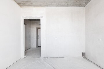 interior of the apartment without decoration in gray colors. rough finish