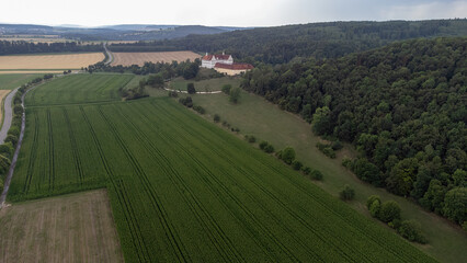 Fototapeta na wymiar Mochental Castle with landscape taken from above, drone photo