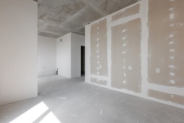 interior of the apartment without decoration in gray colors. rough finish