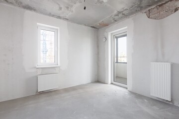 interior of the apartment without decoration in gray colors. rough finish