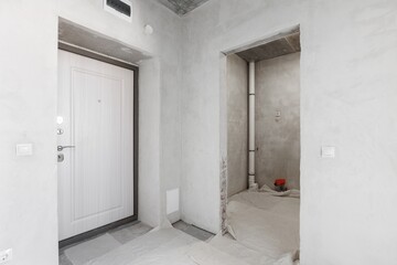 interior of the apartment without decoration in gray colors. rough finish