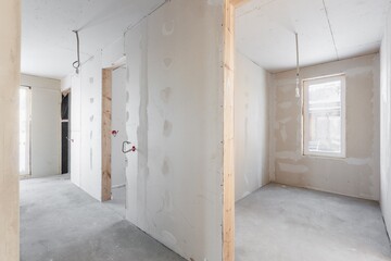 interior of the apartment without decoration in gray colors. rough finish
