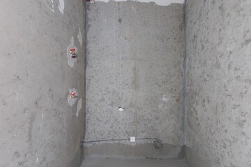 interior of the apartment without decoration in gray colors. rough finish