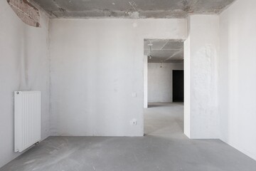 interior of the apartment without decoration in gray colors. rough finish