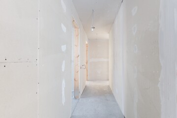 interior of the apartment without decoration in gray colors. rough finish