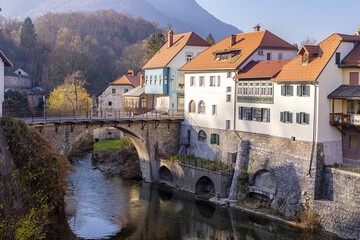 Fototapeta na wymiar Capuchin Bridge in Skofja Loka over Selska Sora river, medieval town in Slovenia