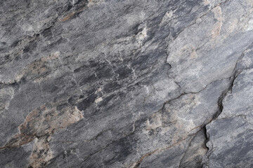 Rough granite stone texture with a polished edge