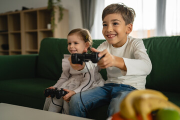 brother and sister siblings boy and girl play video game console