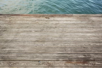 Fototapete Wooden dock texture with weathered planks © SappiStudio